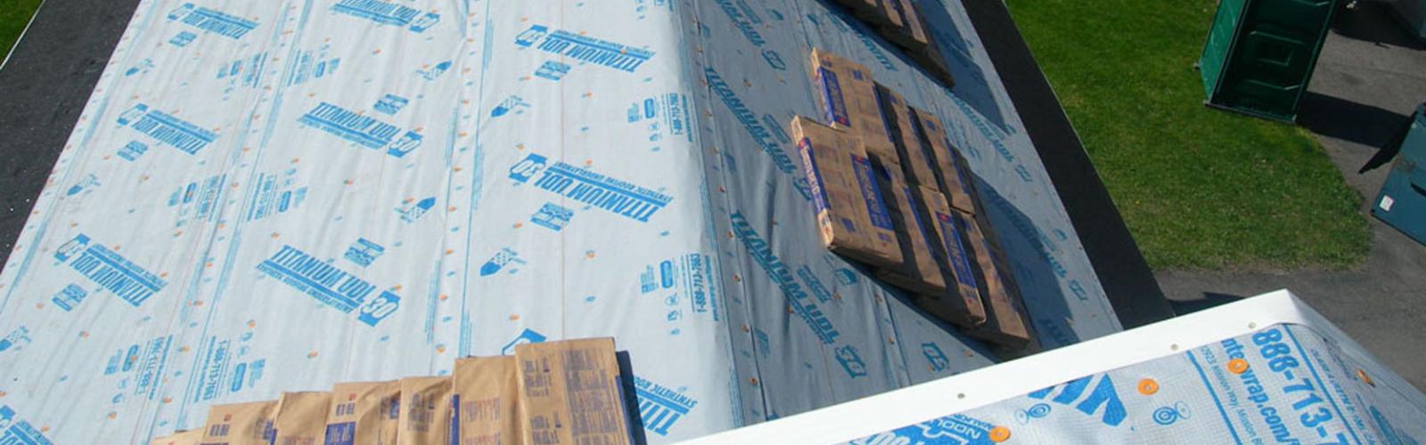 installing shingles bozeman mt roof hail damage Harmon Enterprises Construction