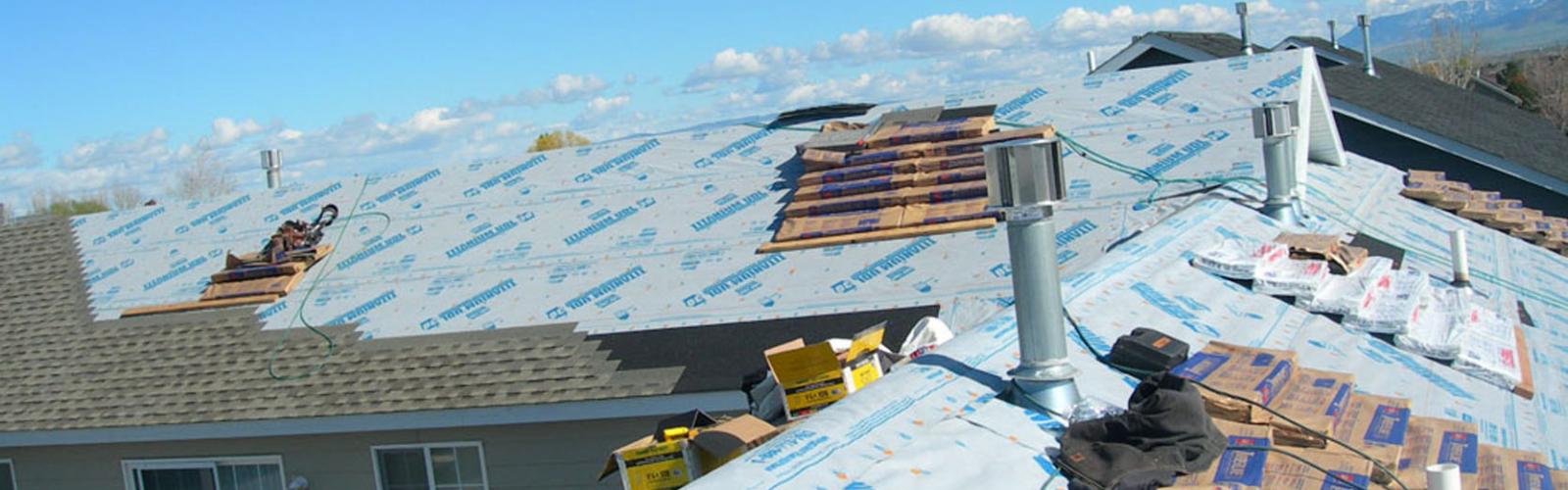installing shingles bozeman mt roof hail damage Harmon Enterprises Construction
