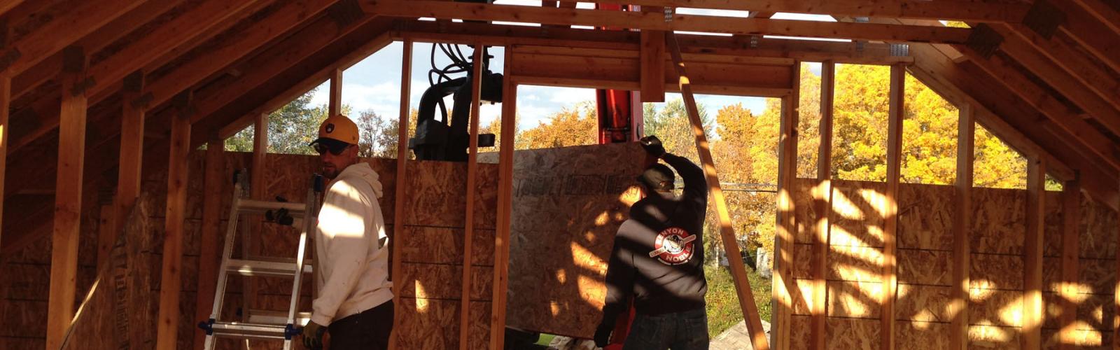 Sheathing is unloaded through a second story window