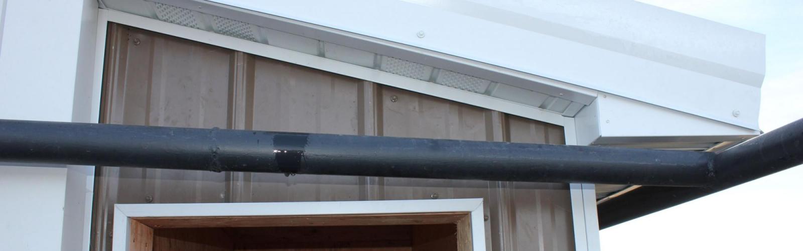 Pumphouse addition metal siding soffit fascia roofing Three Forks MT Harmon Enterprises Construction