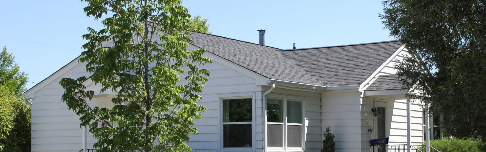 roof over Three Forks Harmon Enerterprises Construction Inc.